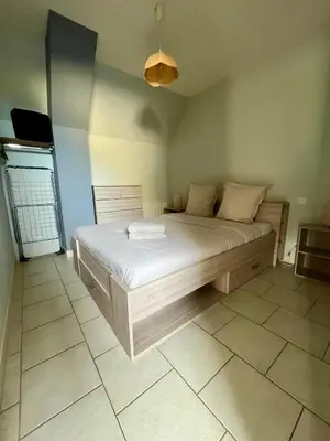 Un ou plusieurs lits dans un hébergement de l'établissement L'Agapanthe, avec accès piscine et jacuzzi