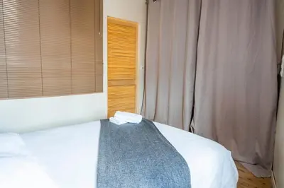 Un ou plusieurs lits dans un hébergement de l'établissement Appartement pour 2, Place Saint-Sauveur