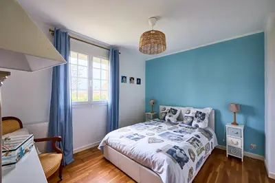 Un ou plusieurs lits dans un hébergement de l'établissement Frontenac - Véranda et jardin clos