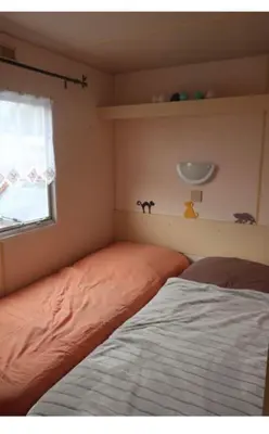 Un ou plusieurs lits dans un hébergement de l'établissement Mobile home à Cancale