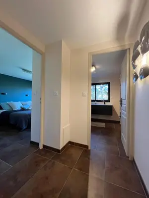 Un ou plusieurs lits dans un hébergement de l'établissement Les Tamaris - Grande Maison de Plage - Jacuzzi