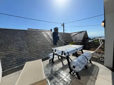 Balcon ou terrasse dans l'établissement Les Tamaris - Grande Maison de Plage - Jacuzzi