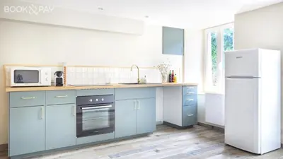 Cuisine ou kitchenette dans l'établissement Maison Portbail-sur-Mer