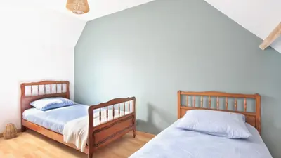 Un ou plusieurs lits dans un hébergement de l'établissement Maison Portbail-sur-Mer