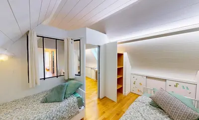 Un ou plusieurs lits dans un hébergement de l'établissement Superbe duplex familial Parking Plage à pied