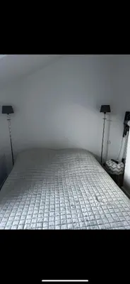 Un ou plusieurs lits dans un hébergement de l'établissement Appartement bord de mer