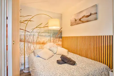 Un ou plusieurs lits dans un hébergement de l'établissement Les Dunes - Jardin Privatif - Plage à 500 Mètres