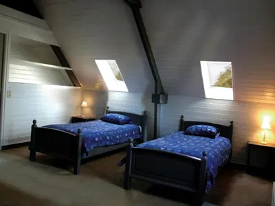Un ou plusieurs lits dans un hébergement de l'établissement Le Clos des Pommiers gîte