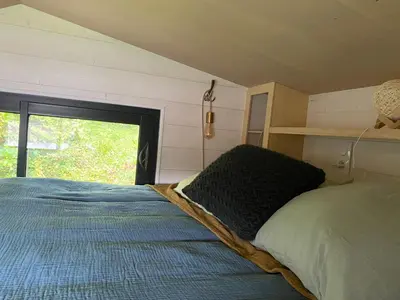 Un ou plusieurs lits dans un hébergement de l'établissement Tiny house des cyclamens St André sur Orne