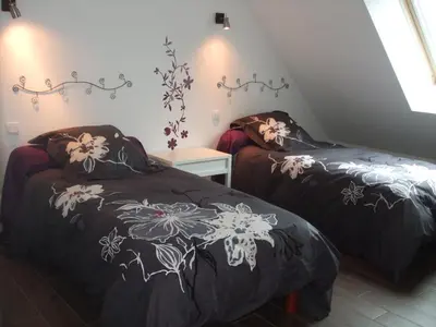 Un ou plusieurs lits dans un hébergement de l'établissement Villa Juliette