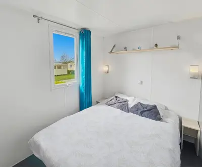 Un ou plusieurs lits dans un hébergement de l'établissement Mobilhome