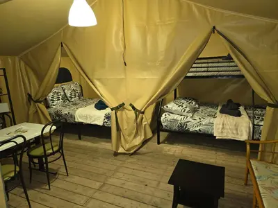 Un ou plusieurs lits dans un hébergement de l'établissement Clos des Monts Tente Lodge Safari J