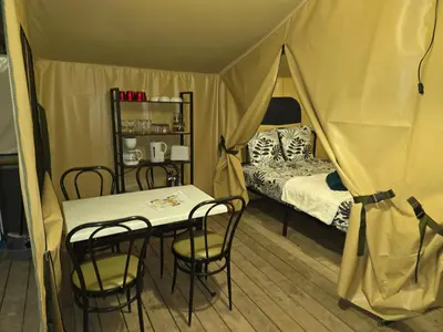 Un ou plusieurs lits dans un hébergement de l'établissement Clos des Monts Tente Lodge Safari R
