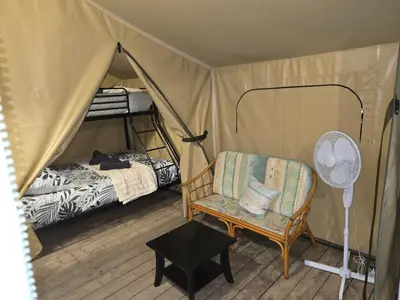 Un ou plusieurs lits dans un hébergement de l'établissement Clos des Monts Tente Lodge Safari R