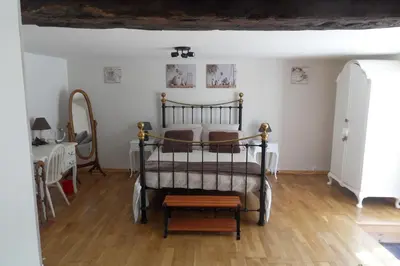 Un ou plusieurs lits dans un hébergement de l'établissement Chambres et table d'hôtes du Vieil Hêtre