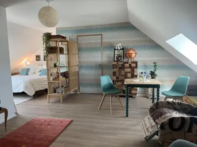 Un ou plusieurs lits dans un hébergement de l'établissement Chambre Voyage du Domaine de la Belle Verte