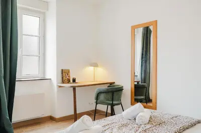Un ou plusieurs lits dans un hébergement de l'établissement La Baie - Appartement de charme entièrement équipé à 5min du Mont St Michel