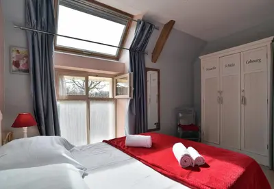 Un ou plusieurs lits dans un hébergement de l'établissement Maisonnette Les Agapanthes de Cancale 23 personne
