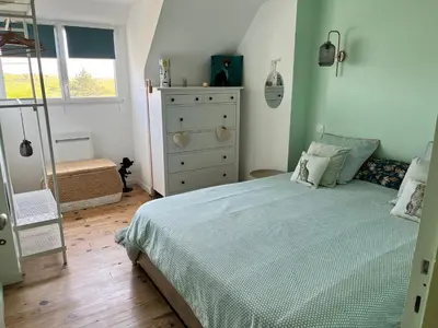 Un ou plusieurs lits dans un hébergement de l'établissement Colora Cottage - A 100 m de la plage