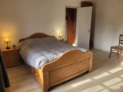 Un ou plusieurs lits dans un hébergement de l'établissement Maison de campagne normande et accueil chevaux