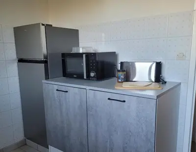 Cuisine ou kitchenette dans l'établissement Maison de campagne normande et accueil chevaux