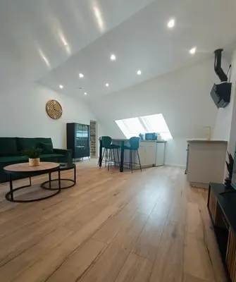 Télévision ou salle de divertissement dans l'établissement L'appart