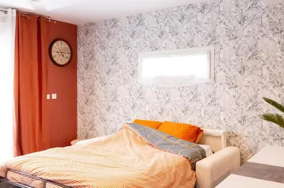 Un ou plusieurs lits dans un hébergement de l'établissement Loft tout confort avec parking et à moins 15 min Caen et des Plages