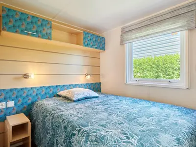 Un ou plusieurs lits dans un hébergement de l'établissement Holiday Home Super Octalia - camping 5 by Interhome