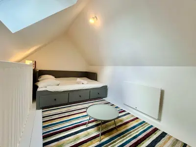Un ou plusieurs lits dans un hébergement de l'établissement La maison de l'Orangerie - Charm & comfort in the very heart of Carentan
