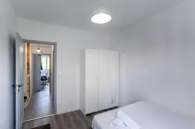 Un ou plusieurs lits dans un hébergement de l'établissement Spacieux Appartement 4 Chambres