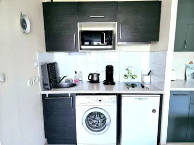 Cuisine ou kitchenette dans l'établissement Bel Appartement à RIVA BELLA - Parking Privé
