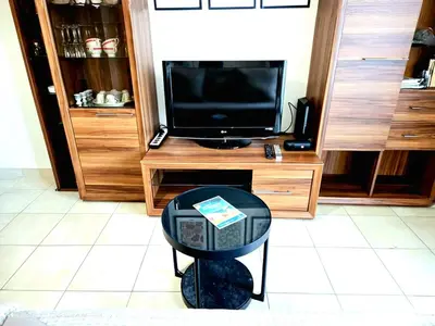 Télévision ou salle de divertissement dans l'établissement Bel Appartement à RIVA BELLA - Parking Privé