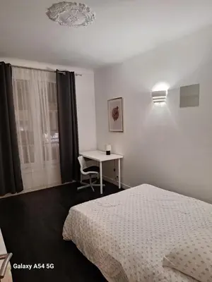 Un ou plusieurs lits dans un hébergement de l'établissement appart hyper centre confortable