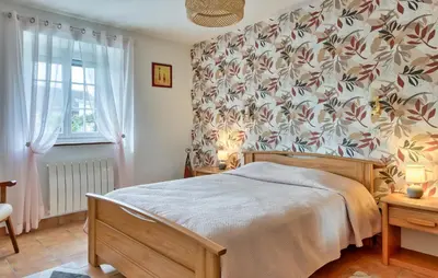 Un ou plusieurs lits dans un hébergement de l'établissement Charmante Maison De Campagne