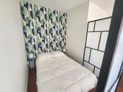 Un ou plusieurs lits dans un hébergement de l'établissement Grand studio 40m² avec coin nuit, vue mer et port, parking privé - FR-1-746-29