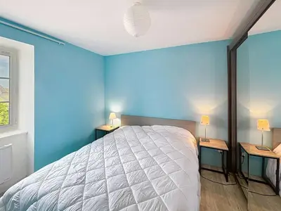 Un ou plusieurs lits dans un hébergement de l'établissement Appartement lumineux à Jullouville, proche plage, avec parking et wifi gratuit - FR-1-361-565