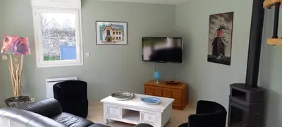 Télévision ou salle de divertissement dans l'établissement Retour de plage