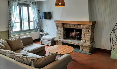 Coin salon dans l'établissement Maison cosy & jardin privé Plages à 5 min
