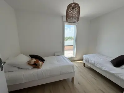 Un ou plusieurs lits dans un hébergement de l'établissement Appartement Le Riva B304