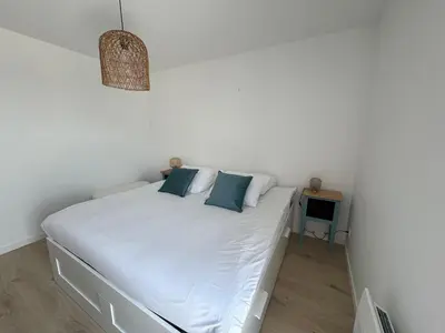 Un ou plusieurs lits dans un hébergement de l'établissement Appartement Le Riva B304
