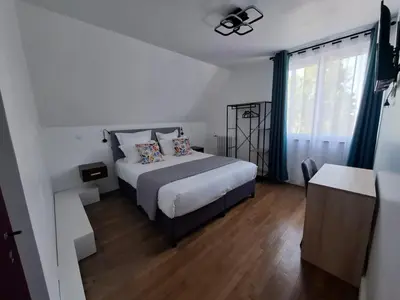 Un ou plusieurs lits dans un hébergement de l'établissement La Villa Cassinne Chambres Indépendantes