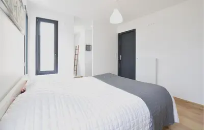 Un ou plusieurs lits dans un hébergement de l'établissement Maison Moderne Proche Plage
