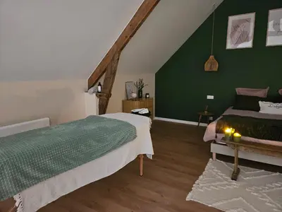 Un ou plusieurs lits dans un hébergement de l'établissement Gîtes Nos jours heureux - L'idylle, gîte de caractère