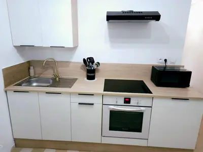 Cuisine ou kitchenette dans l'établissement Logement Cosy & Spacieux Hypercentre CAEN