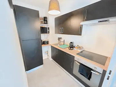Cuisine ou kitchenette dans l'établissement La croisette - à 50 mètres de la plage de Juno Beach avec Balcon et Stationnement gratuit