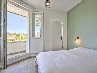 Un ou plusieurs lits dans un hébergement de l'établissement Appartement lumineux avec 2 balcons à 600m de la plage - FR-1-788-78