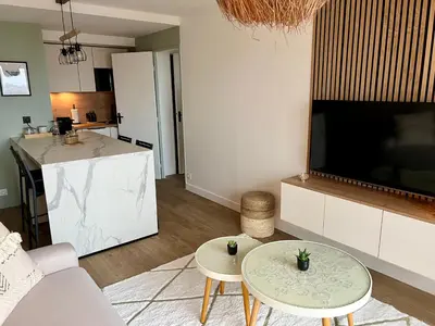 Télévision ou salle de divertissement dans l'établissement Une Escale chaleureuse !