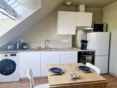 Cuisine ou kitchenette dans l'établissement L'Ermitage Scandi