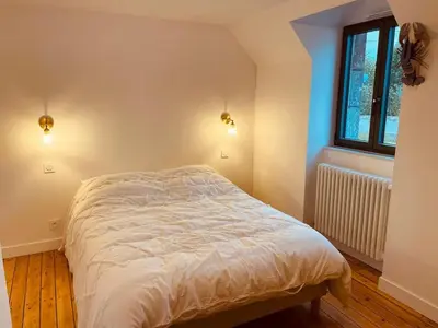 Un ou plusieurs lits dans un hébergement de l'établissement Maison Yodée