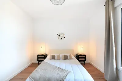 Un ou plusieurs lits dans un hébergement de l'établissement Le Coquillage - Joli T3 avec grand balcon